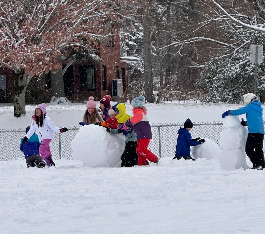 students playing in the snow 