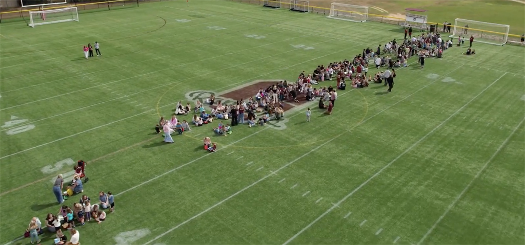 seniors and kindergarten students meeting in the middle